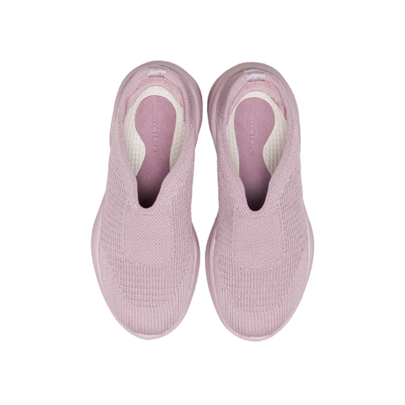 Woman wearing Rebecca Lim's arch support shoes for back pain relief