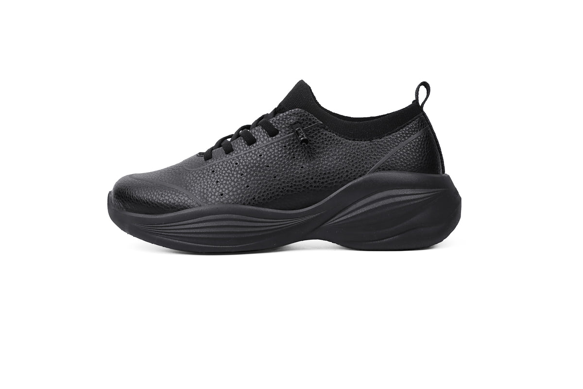 Woman wearing Rebecca Lim's arch support shoes for back pain relief