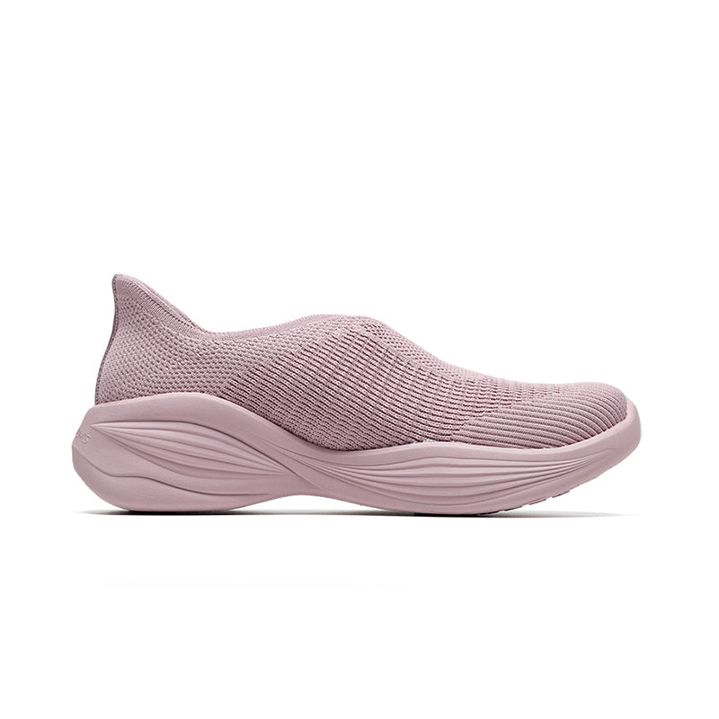 Woman wearing Rebecca Lim's arch support shoes for back pain relief