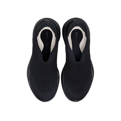 Woman wearing Rebecca Lim's arch support shoes for back pain relief