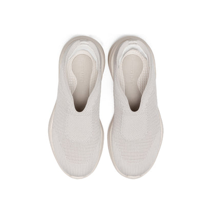 Woman wearing Rebecca Lim's arch support shoes for back pain relief