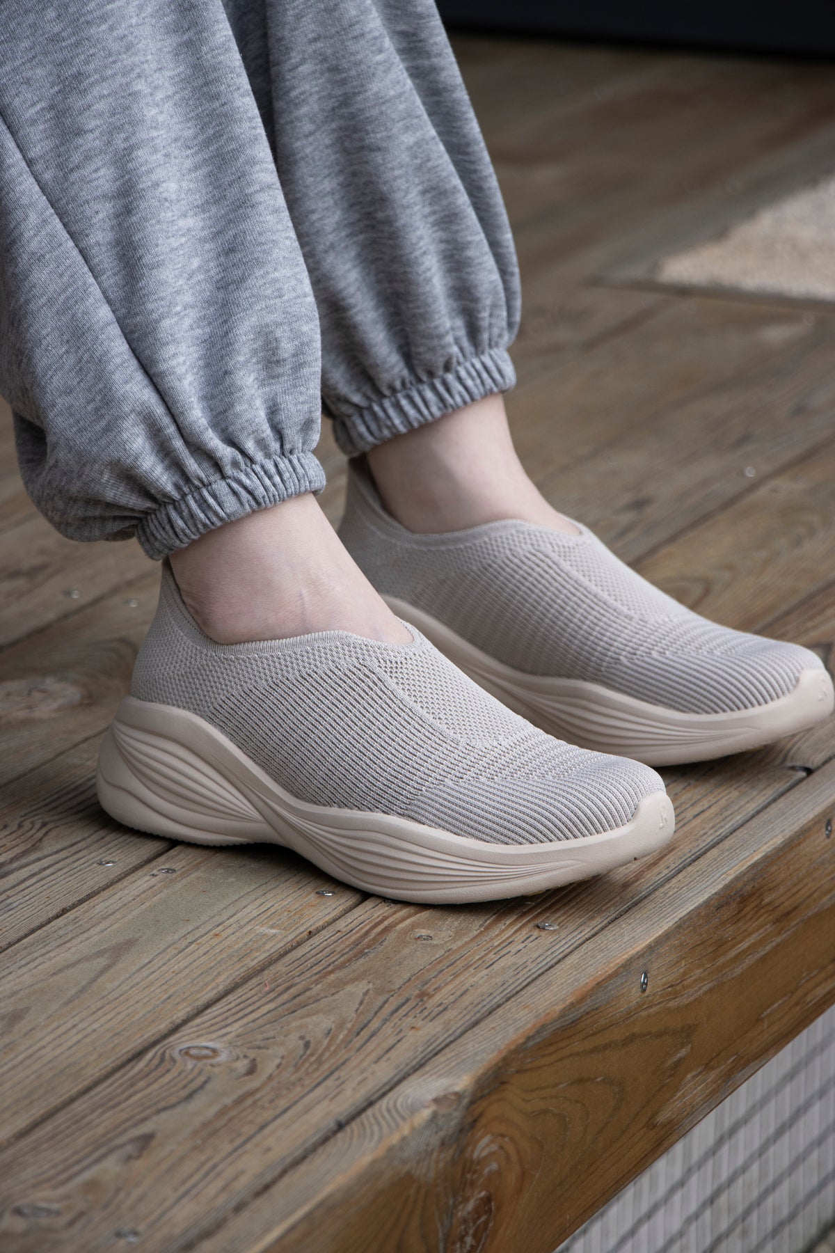 Woman wearing Rebecca Lim's arch support shoes for back pain relief