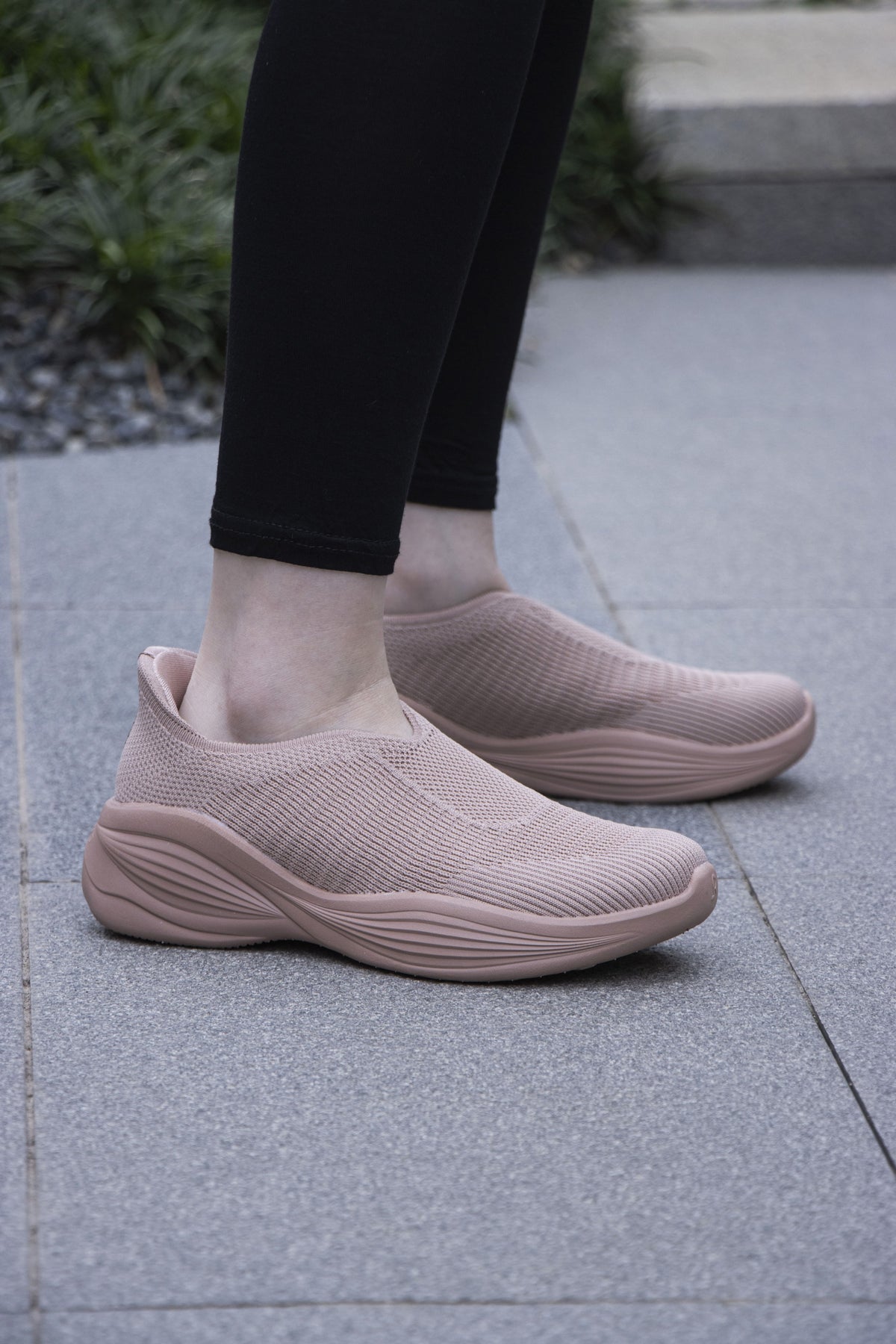 Woman wearing Rebecca Lim's arch support shoes for back pain relief