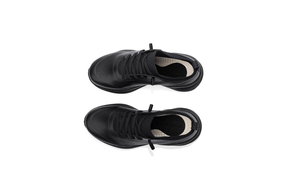 Woman wearing Rebecca Lim's arch support shoes for back pain relief