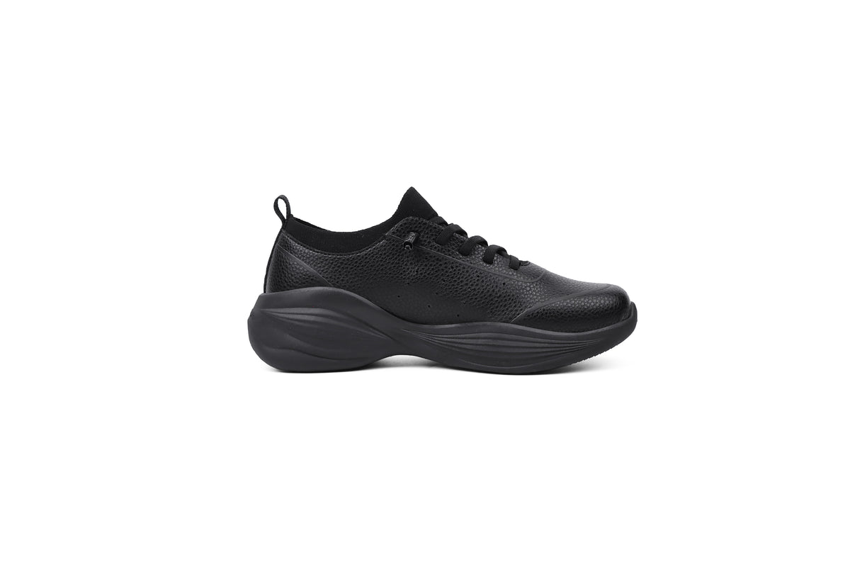 Woman wearing Rebecca Lim's arch support shoes for back pain relief