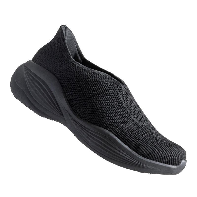 Woman wearing Rebecca Lim's arch support shoes for back pain relief